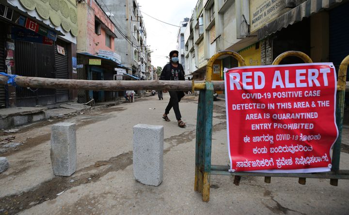 A notice displayed by authorities on a makeshift barricade set up to restrict entry in a containment zone in Bengaluru on July 5, 2020.