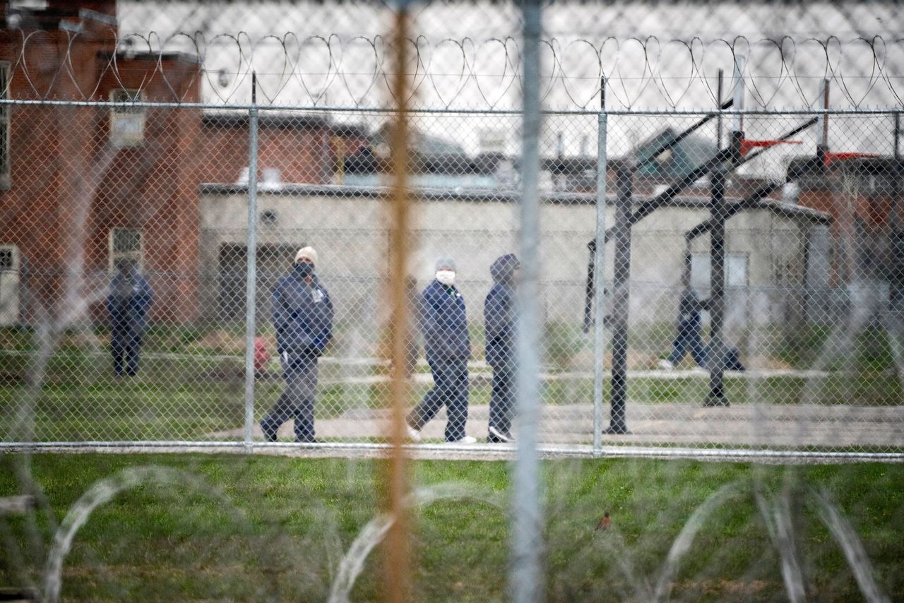 People walk in the yard at Marion Correctional Institution on April 22, just after the prison completed mass testing for the coronavirus.