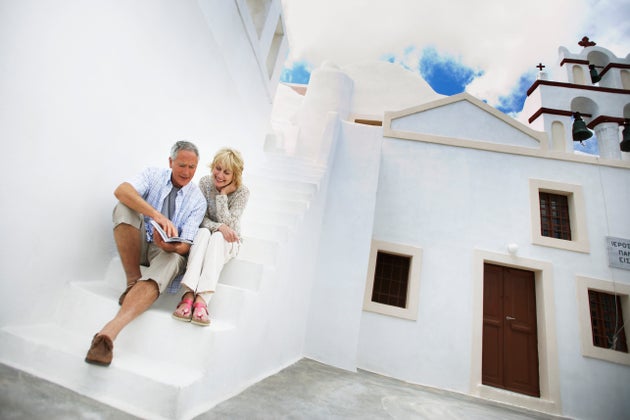 Vacationing Couple Looking at Guidebook