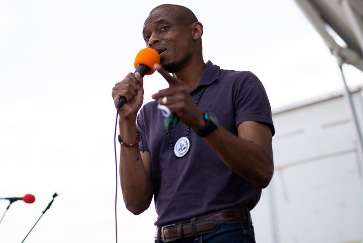 Antone Melton-Meaux, an attorney challenging Rep. Omar, speaks at a Juneteenth celebration in Minneapolis. He's running as a bridge-builder who will better serve the district.