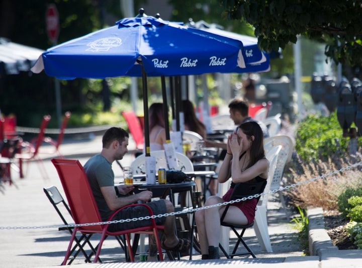 Restaurants, bars and other food and drink establishments are open for dining in outdoor areas, like patios, curbside, parking lots and adjacent properties in the places of Ontario cleared to enter Phase 2 of reopening amid the COVID-19 pandemic in Hamilton, Ont. on July 7, 2020.