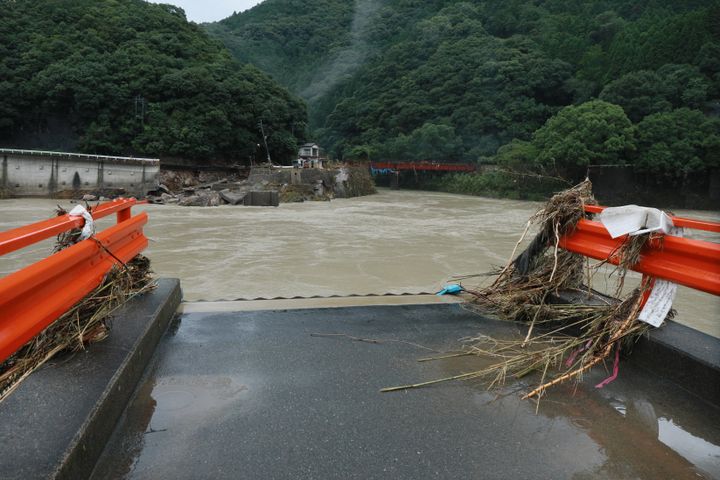 大雨で流された球磨川の深水橋＝7日午前、熊本県八代市