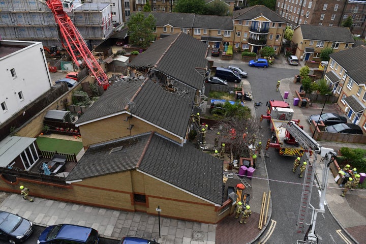 <strong>The scene in Bow where a 20-metre crane collapsed on to a property leaving people trapped inside, in east London, Wednesday.</strong>