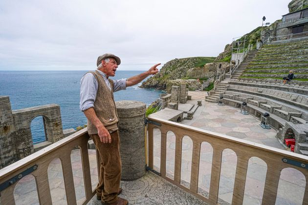 Actor Mark Harandon rehearsing alone at the open air Minack Theatre set in to the cliffs at Porthcurno, in Cornwall.