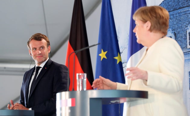 German Chancellor Angela Merkel and French President Emmanuel Macron give a press conference on June...