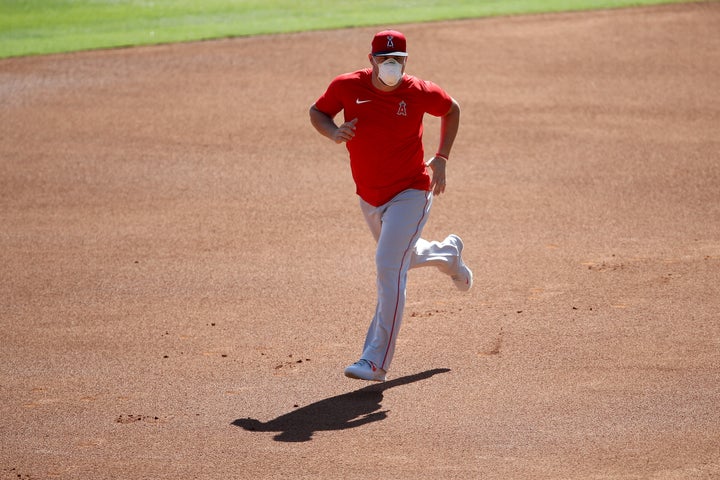 The Los Angeles Angels and at least three other Major League Baseball teams temporarily halted summer camp preparations for the 2020 season after delays in receiving coronavirus test results.