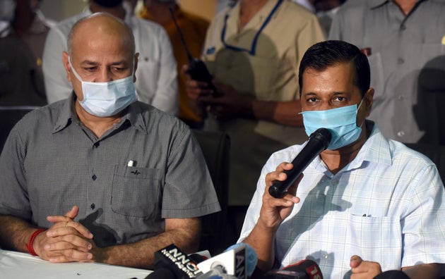 Delhi Chief Minister Arvind Kejriwal and Deputy CM Manish Sisodia address the media during a visit to...