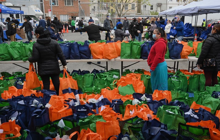 Catholic Charities host a pop-up food distribution site for community members impacted by the coronavirus pandemic on May 8,