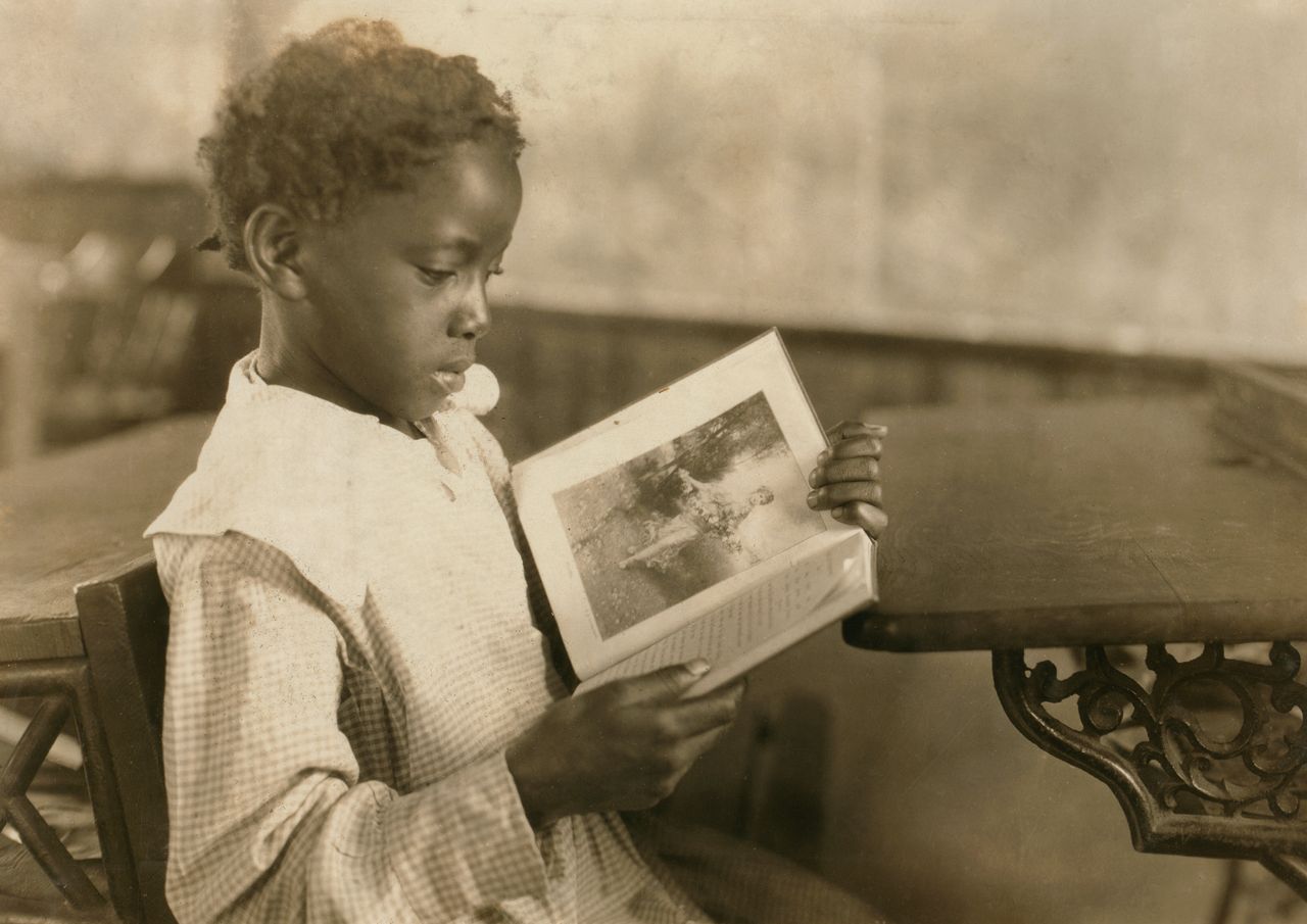 Young Girl Reading Book in Classroom, Pleasant Green School, Marlinton, Pocahontas County, West Virginia, USA, circa 1921. (Photo by: Universal History Archive/Universal Images Group via Getty Images)