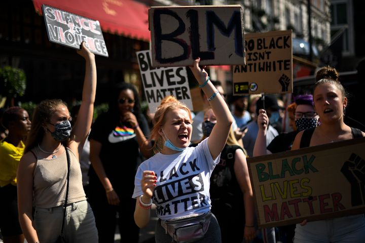 People march as they attend a Black Lives Matter protest in London