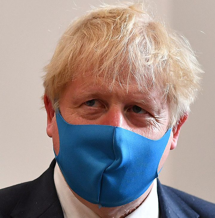 Boris Johnson, wearing a face mask, visits the headquarters of the London Ambulance Service NHS Trust in London