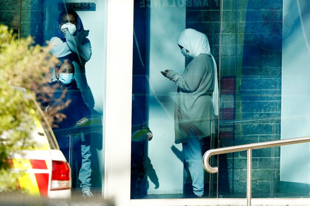 A family forced to stay in their home at the North Melbourne Public Housing tower complex on July