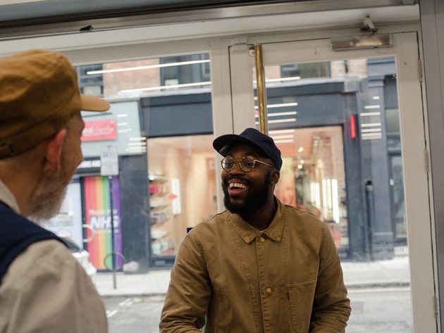 Universal Works co-founder and designer, David Keyte, greets regular customer Daniel Bolarinwa