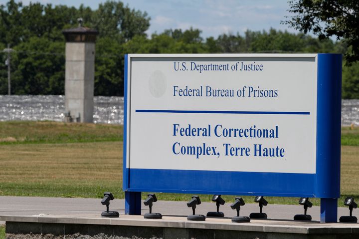 The entrance to the federal prison in Terre Haute, Ind., is shown Monday, July 13, 2020. Daniel Lewis Lee, a convicted killer, was executed there Tuesday. He was convicted in Arkansas of the 1996 killings of gun dealer William Mueller, his wife, Nancy, and her 8-year-old daughter, Sarah Powell. (AP Photo/Michael Conroy)