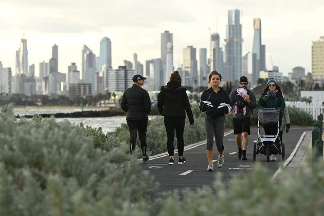 Melburnians exercise along Elwood Beach on July 13, 2020 in Melbourne, Australia. Metropolitan Melbourne and the Mitchell shire are in lockdown following the rise in COVID-19 cases through community transmissions.