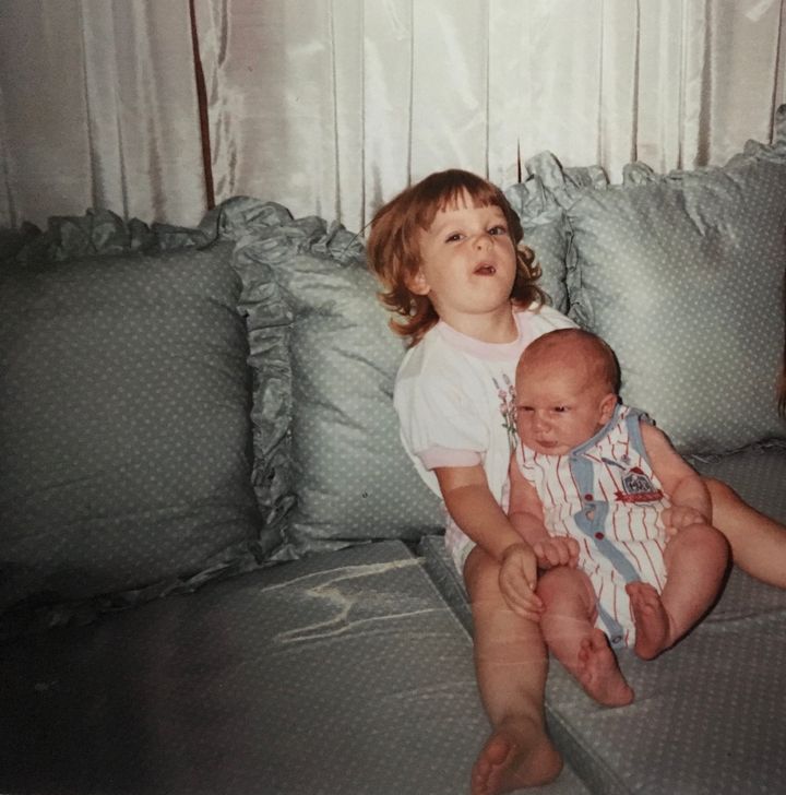 The author with her new baby brother in the late '80s