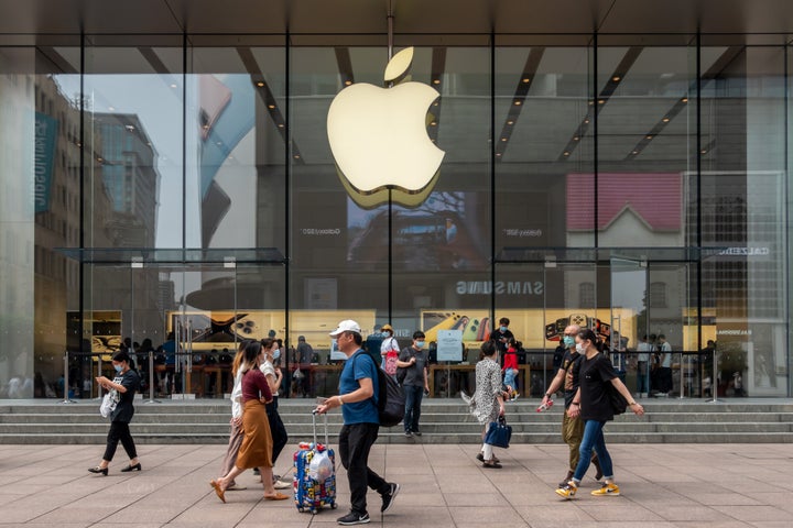 SHANGHAI, CHINA - JUN 01: People walk by an Apple store at Nanjing Road Walking Street on June 1, 2020 in Shanghai, China. (Photo by Wang Gang/VCG via Getty Images)