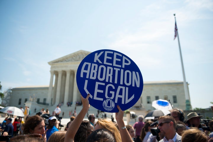 Abortion rights supporters celebrate in front of the U.S. Supreme Court after the court, in a 5-3 ruling, struck down a Texas abortion access law in June 2016.