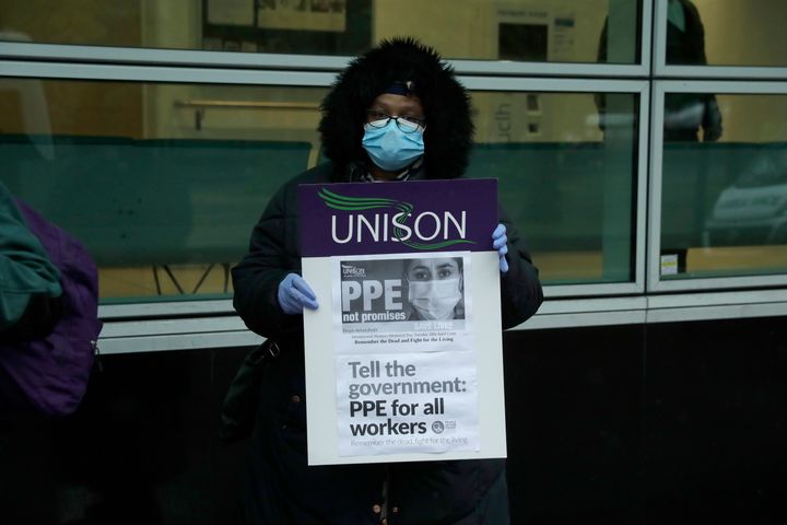 A hospital worker at a protest in April