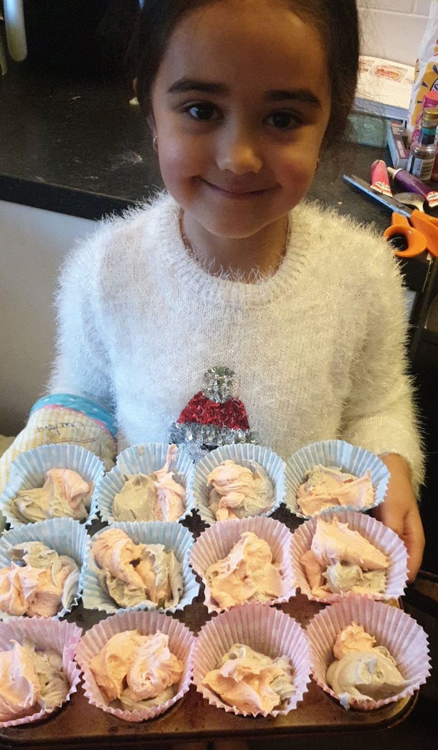 Terri-Anne's daughter Amayah with some of the baking she has done in lockdown