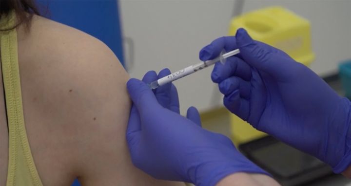 Screen grab taken from video issued by Oxford University, showing a person being injected as part of the first human trials in the UK to test a potential coronavirus vaccine