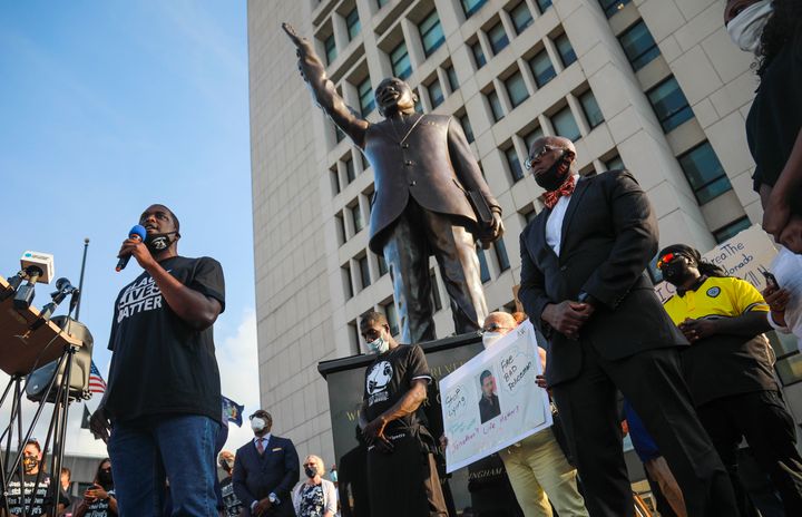 Mondaire Jones, left, winner of the Democratic primary for the 17th Congressional District, addresses a Black Lives Matter rally near a statue of Martin Luther King Jr., Wednesday, July 15, 2020, outside the Westchester County courthouse in White Plains, N.Y. 