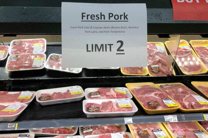 A sign at a Kroger store in Atlanta limits shoppers to two packages of pork on May 5. Kroger, like a number of other grocery retailers, announced limits on meat purchases at the time due to supply concerns amid the COVID-19 pandemic.
