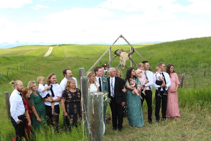 The families of Kadee and Jaxson Jensen pose at the Alberta-Montana border. The COVID-19 pandemic has shuttered non-essential travel between Canada and the U.S., leaving families to get creative with seeing each other.