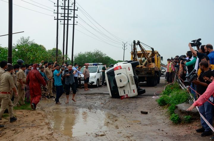 The overturned vehicle that was carrying Vikas Dubey is towed away near Kanpur, July 10, 2020. 