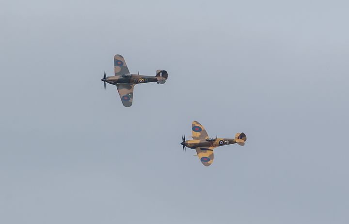 A Battle of Britain Memorial Flight flypast of a Spitfire and a Hurricane passes over the home of Captain Tom Moore as he celebrates his 100th birthday. 