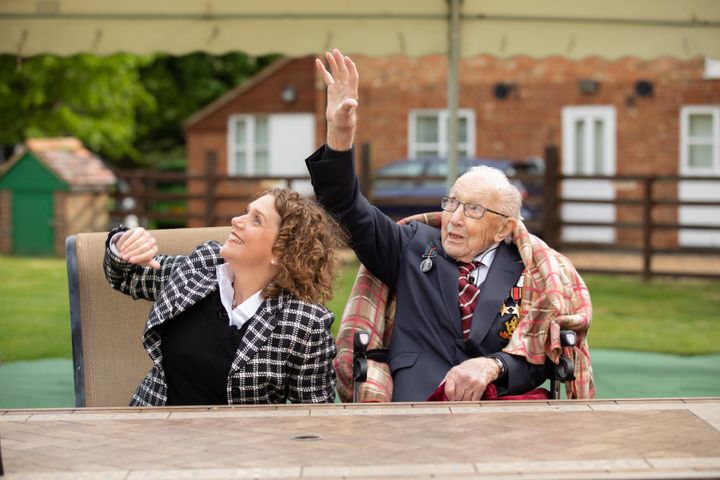 Colonel Tom Moore and his daughter Hannah celebrate his 100th birthday, with an RAF flypast provided by a Spitfire and a Hurricane over his home on April 30.