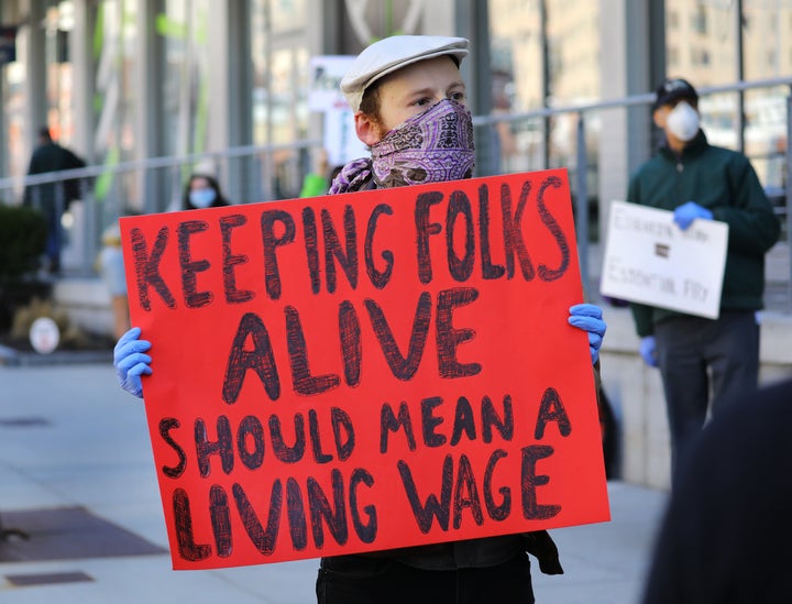 Grocery store workers and others staged a protest outside the Whole Foods Market in the South End of Boston in April to demand personal protective equipment, added benefits if needed and hazard pay.