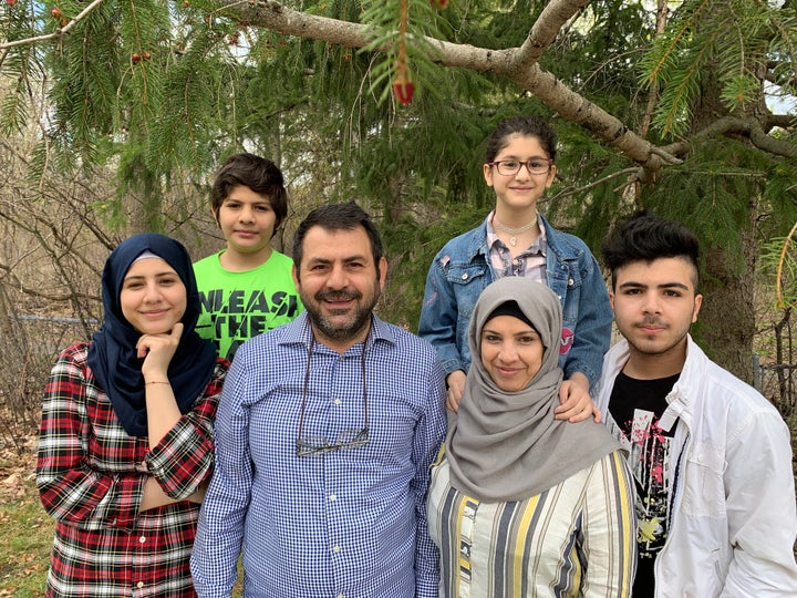 The Abou Rshd family. Emad Abou Rshd and his wife, Lamis, centre, with their children, from left clockwise: Aya, 18, Ibrahim, 11, Hala, 11, and Ahmad, 19.