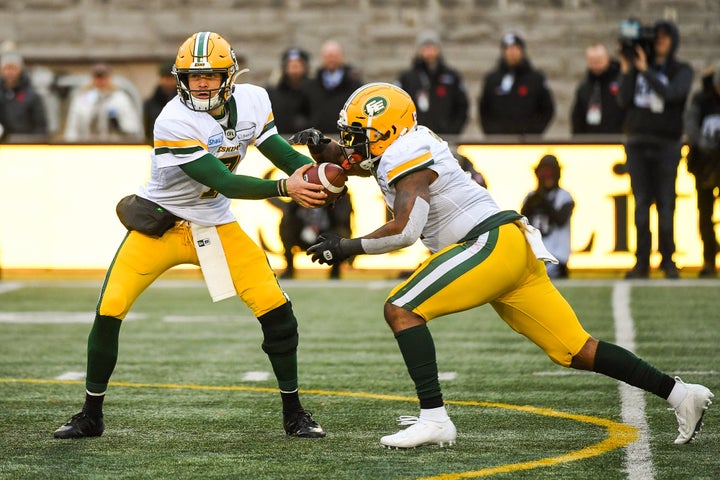 Edmonton CFL quarterback Trevor Harris hands the ball off during a game on Nov. 10, 2019.