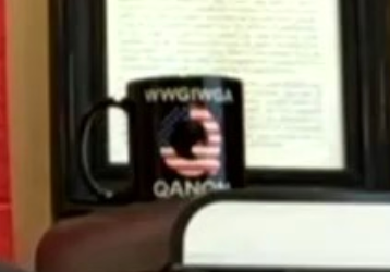 A closer look at the QAnon coffee mug behind Sergeants Benevolent Association President Ed Mullins.