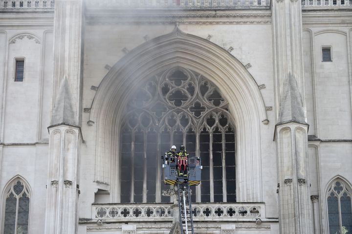 Firefighters at the Saint-Pierre-et-Saint-Paul cathedral in Nantes, western France.