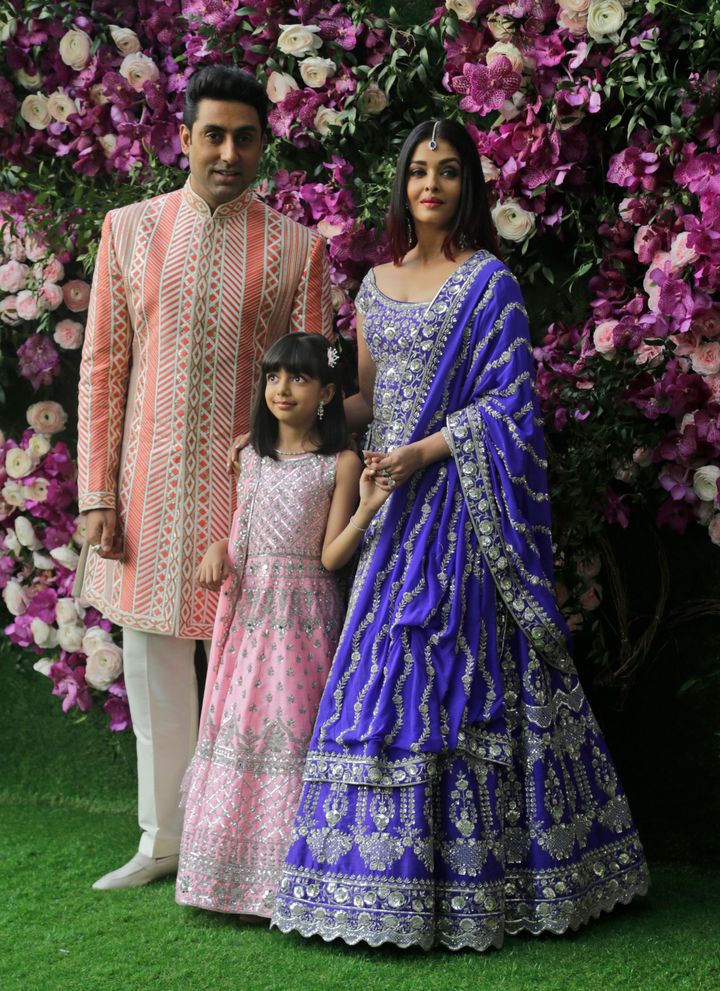Bollywood actor Abhishek Bachchan, his wife Aishwarya Rai Bachchan and daughter Aradhya stand for photographs as they arrive for a wedding on March 9, 2019.