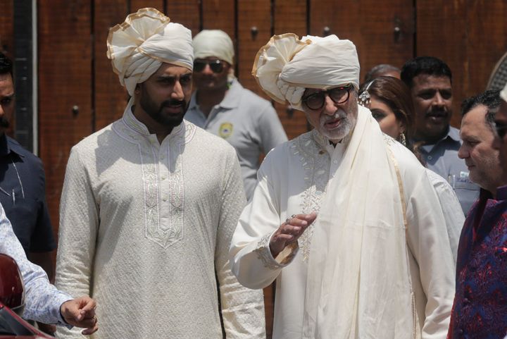 Bollywood actor Amitabh Bachchan and son Abhishek Bachchan leave after attending the marriage ceremony of Bollywood actress Sonam Kapoor in Mumbai, on May 8, 2018.