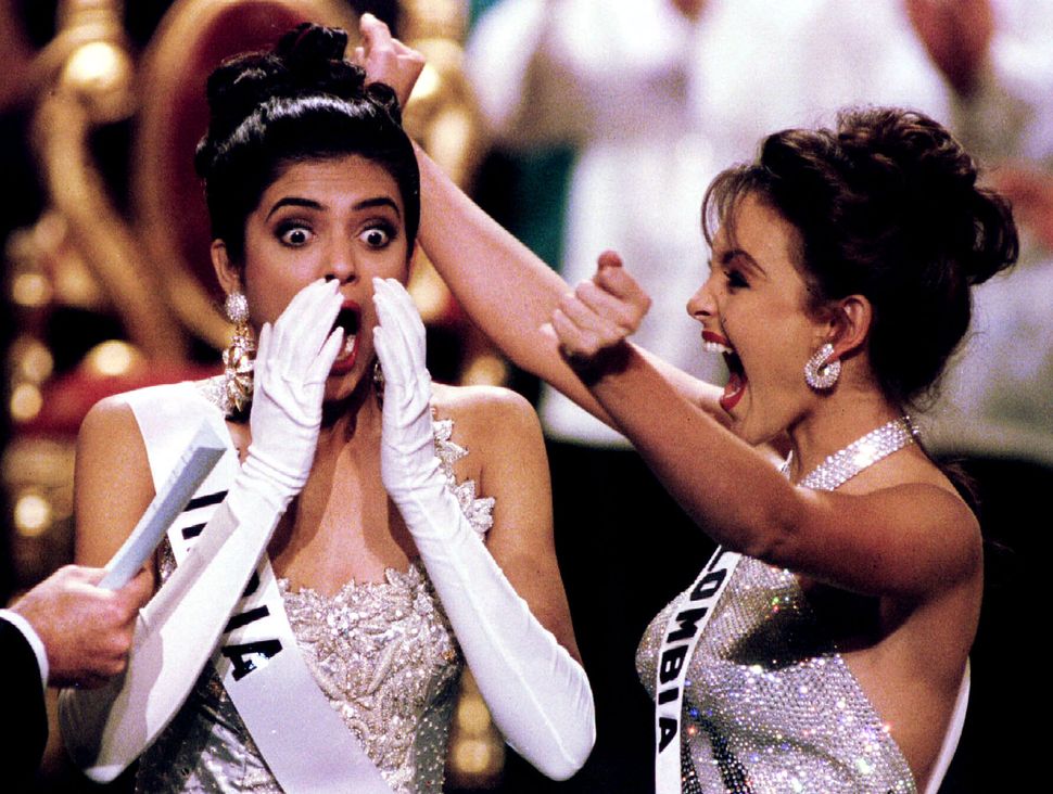 Miss India Sushmita Sen reacts after winning the Miss Universe beauty pageant in Manila May 21. At right jubilating is first runner up Miss Colombia Carolina Gomez