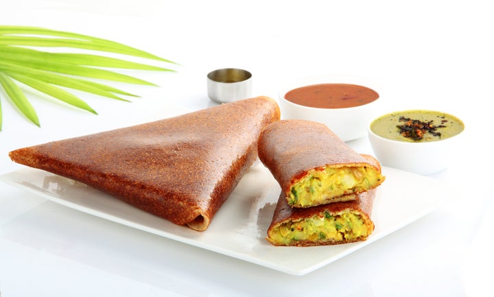 Masala Dosa is made by stuffing by a dosa with lightly cooked filling of potatoes, fried onions and spices. This can be served with chutney and sambar. This can be eaten for breakfast.