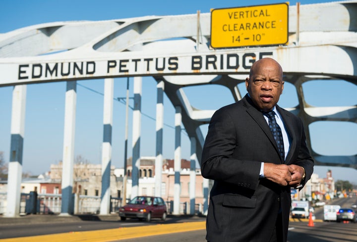 Rep. John Lewis stands on the Edmund Pettus Bridge in Selma, Alabama, in between television interviews on Feb. 14, 2015.