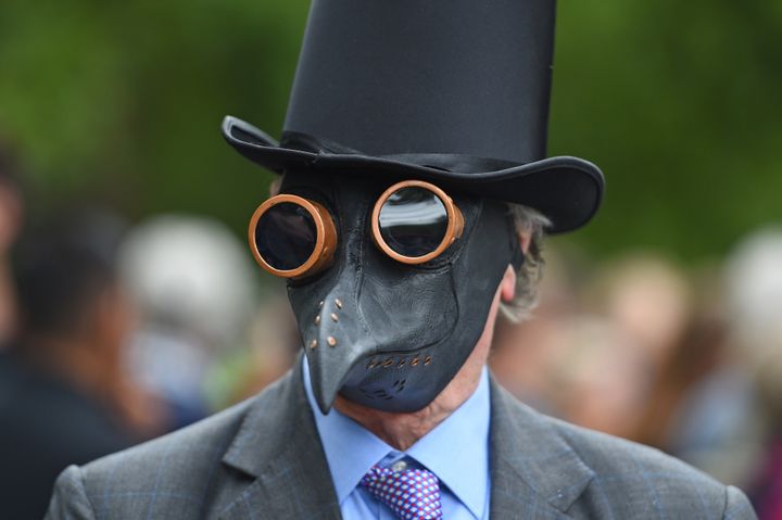 A man wearing a plaque mask attending a protest against the wearing of masks during the coronavirus outbreak, in Hyde Park, London.