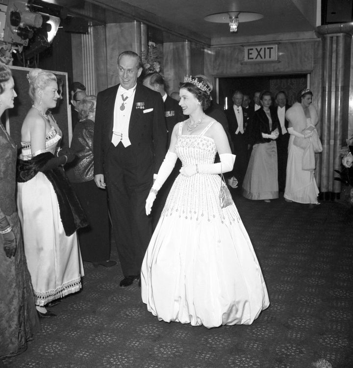 Queen Elizabeth wearing the original dress in 1962 at the premiere of "Lawrence of Arabia." Princess Beatrice wore an updated version of the vintage gown in her wedding ceremony over the weekend.