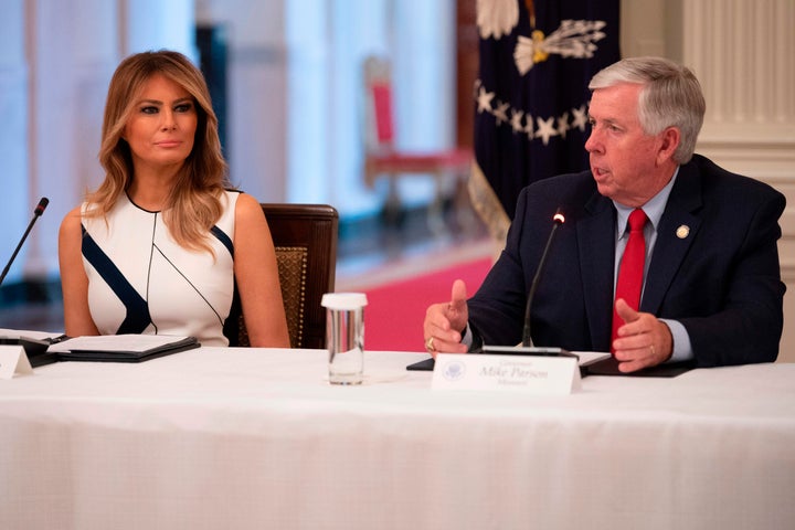 Missouri Gov. Mike Parson with First Lady Melania Trump earlier this month. Parson appears to not know or care that reopening schools puts adults in danger too. 