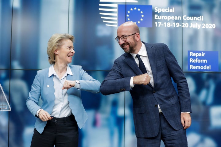 European Commission President Ursula von der Leyen and European Council President Charles Michel bump elbows at the end of the news conference announcing the EU's landmark economic rescue plan.