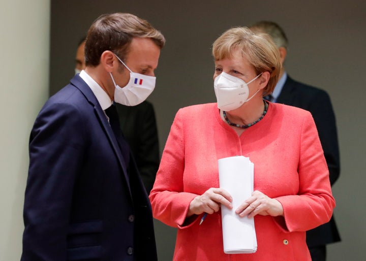 Macron and German Chancellor Angela Merkel at the summit. The two leaders pushed to approve a robust economic stimulus package in the face of opposition from the "frugal four" nations.