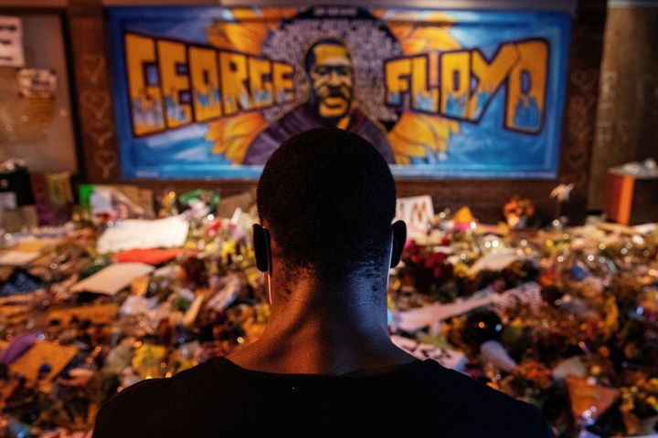 A man recites spoken word poetry at a makeshift memorial honoring George Floyd, at the spot where he was taken into custody, in Minneapolis, on June 1.