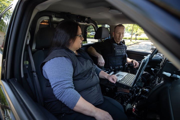 Registered psychiatric nurse Tina Baker and RCMP Cpl. Scotty Schumann are part of the mental health crisis team in Surrey, B.C., pictured here on June 25, 2020.