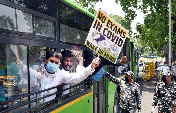 NSUI workers are detained after a protest demanding the cancellation of final year exams and promotion of students on the basis of past performance, outside HRD Ministry at Shastri Bhawan, on July 21, 2020 in New Delhi.