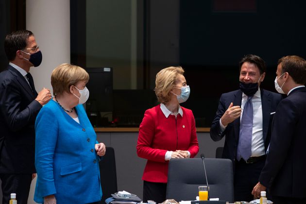 Germany's Chancellor Angela Merkel ( 2nd L) stands next to Netherlands' Prime Minister Mark Rutte (L),...